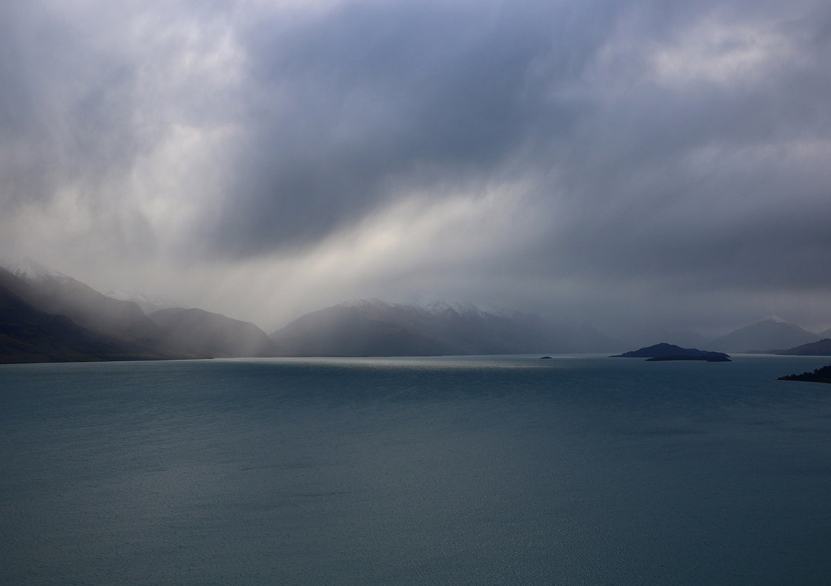 Dark & Stormy | Quent Pfiszter | Studio Quent | Photography | Mountainous landscape with a lake under a cloudy sky | Grey | Blue | Wall Art | Limited Edition Prints | New Zealand